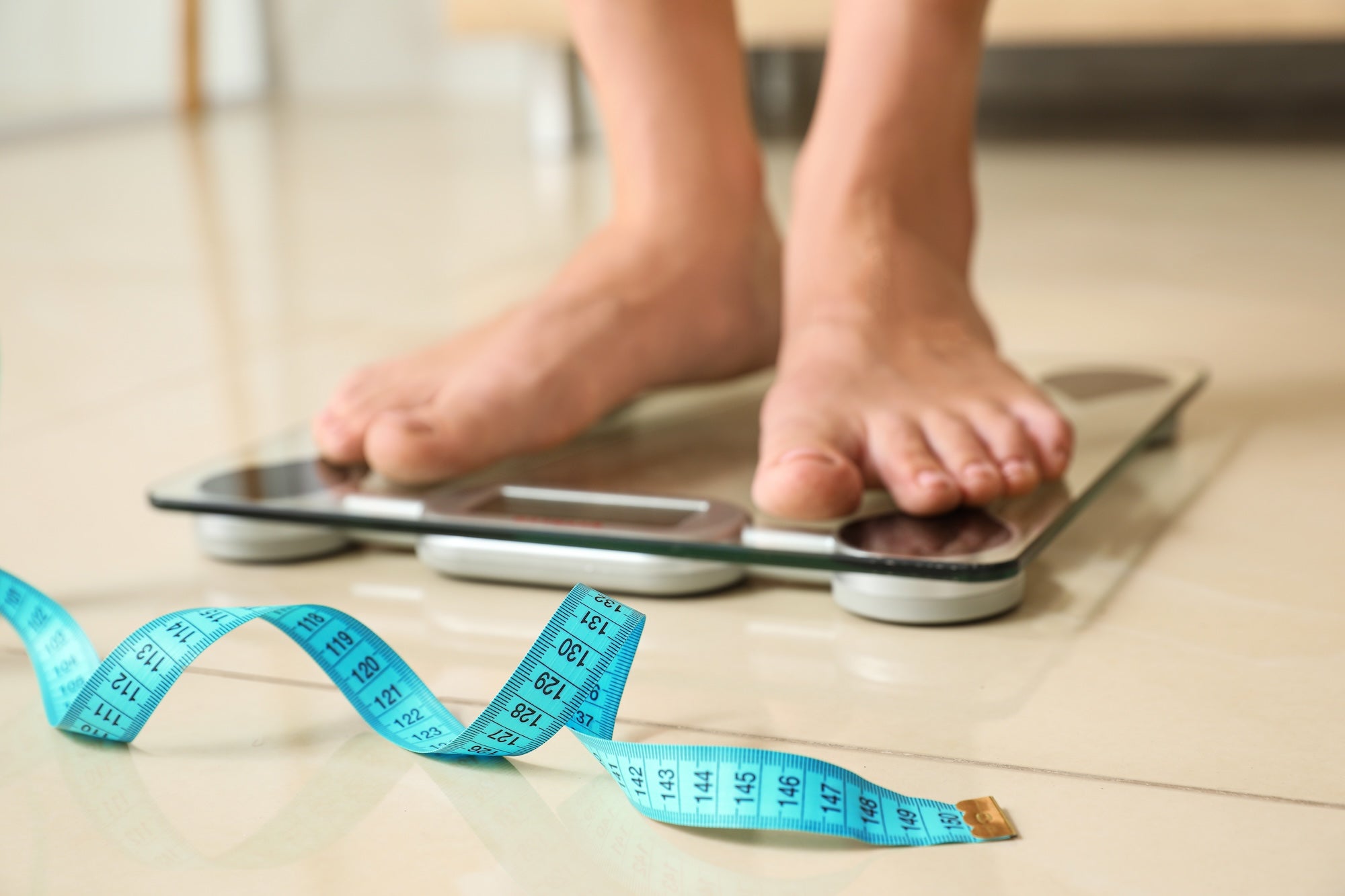 person standing on scales